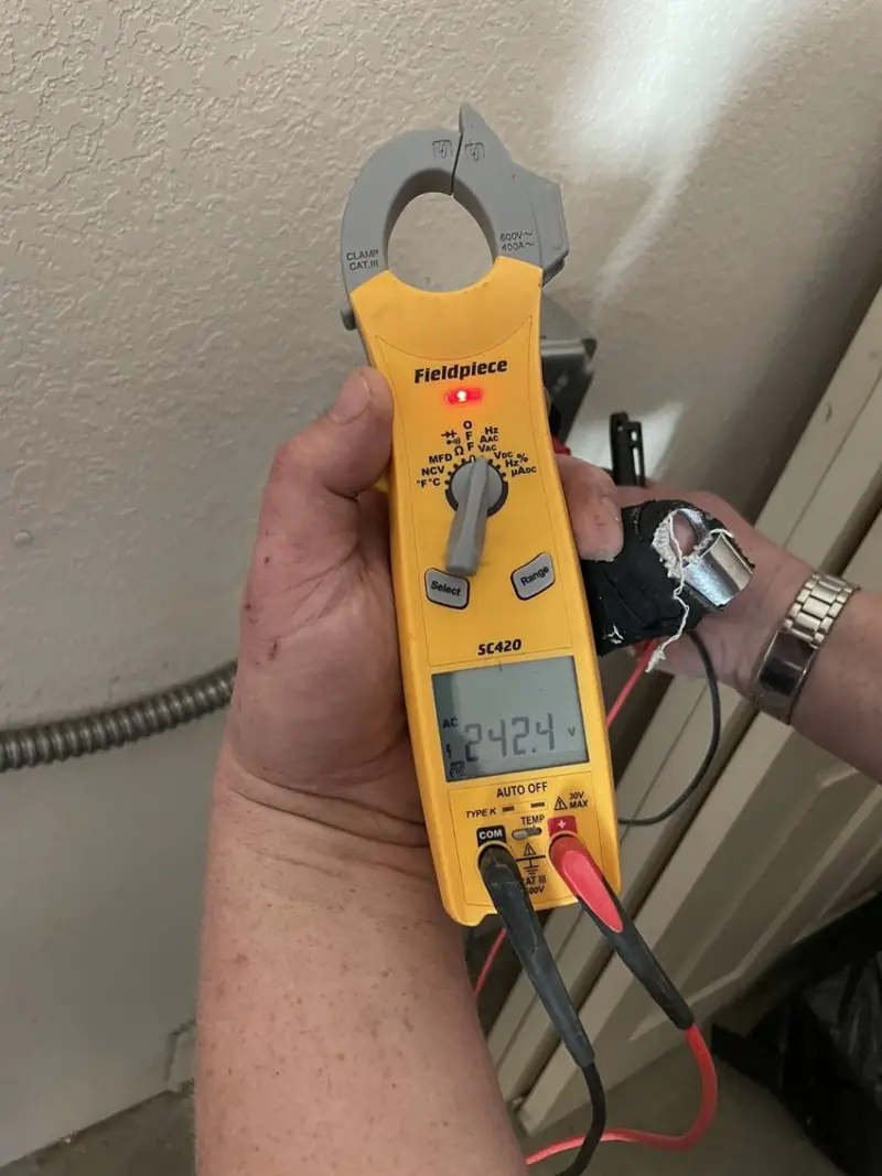 Voltage testing with clamp meter during Electrical Installation Services in Aliquippa